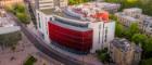 An aerial drone shot of the James McCune Smith building and University Avenue