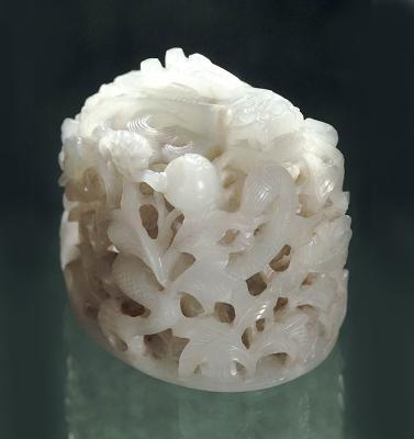Jade; white nephrite hair top-knot, showing dragon in clouds and peonies.