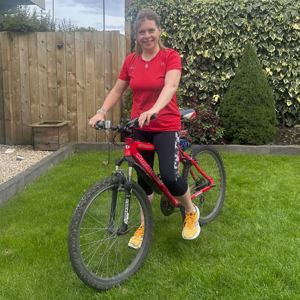 Though she might not always dress to match her bike, Heather Laithwaite (DClinPsy 2002, PhD 2010) was coordinating in style this day.
