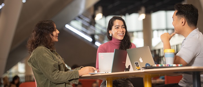 Photo of a small group of students using a University of Glasgow study area