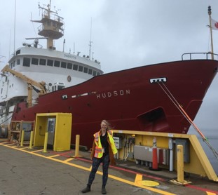 Laurence De Clippele in front of the research vessel The Hudson
