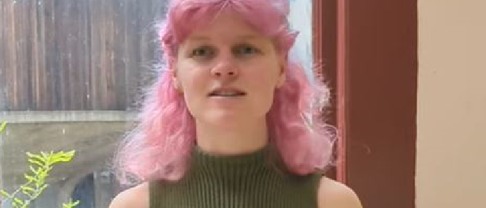 A still from a video of Anna Rourke talking to camera
