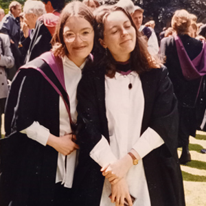 Two graduates in the West Quad