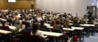 Students sitting in a huge lecture theatre
