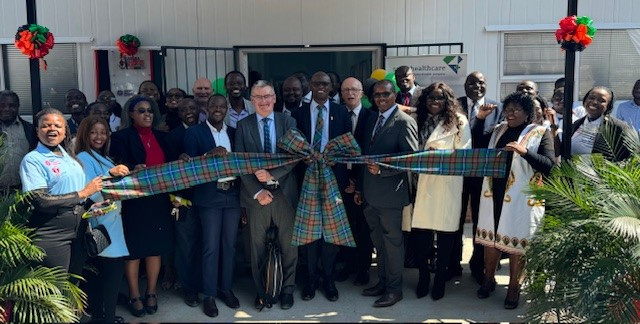 Group picture from the laboratory launch (with attendees holding a Zambian Tartan bow)