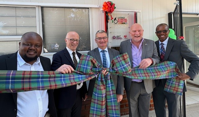 Left to right: Gordon Gandiya (Avacare Health), Prof Andy Waters, Prof Paul Garside, Robert Hanna (African Sun Energy), Dr Mwapatsa Mipando, University of Glasgow, Dean for Global Engagement, Africa (Acting) - all standing holding a tartan bow