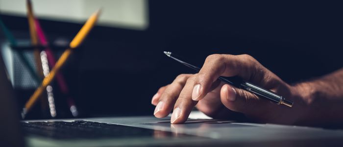 picture of Close up of person working on laptop