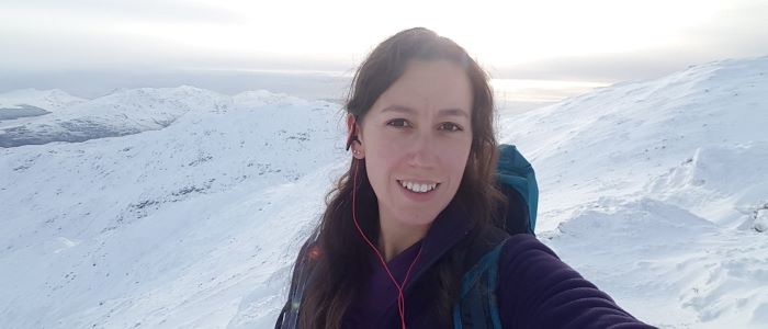 Photo of Heather McClelland with snowy mountain in the background