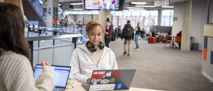 Students using laptops to study