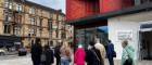 A group of people standing outside the Clarice Pears building