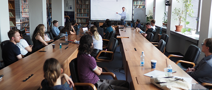 Lecturer presenting to a group of students