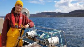 Image of Graeme Cullen wearing a life jacket on a boat