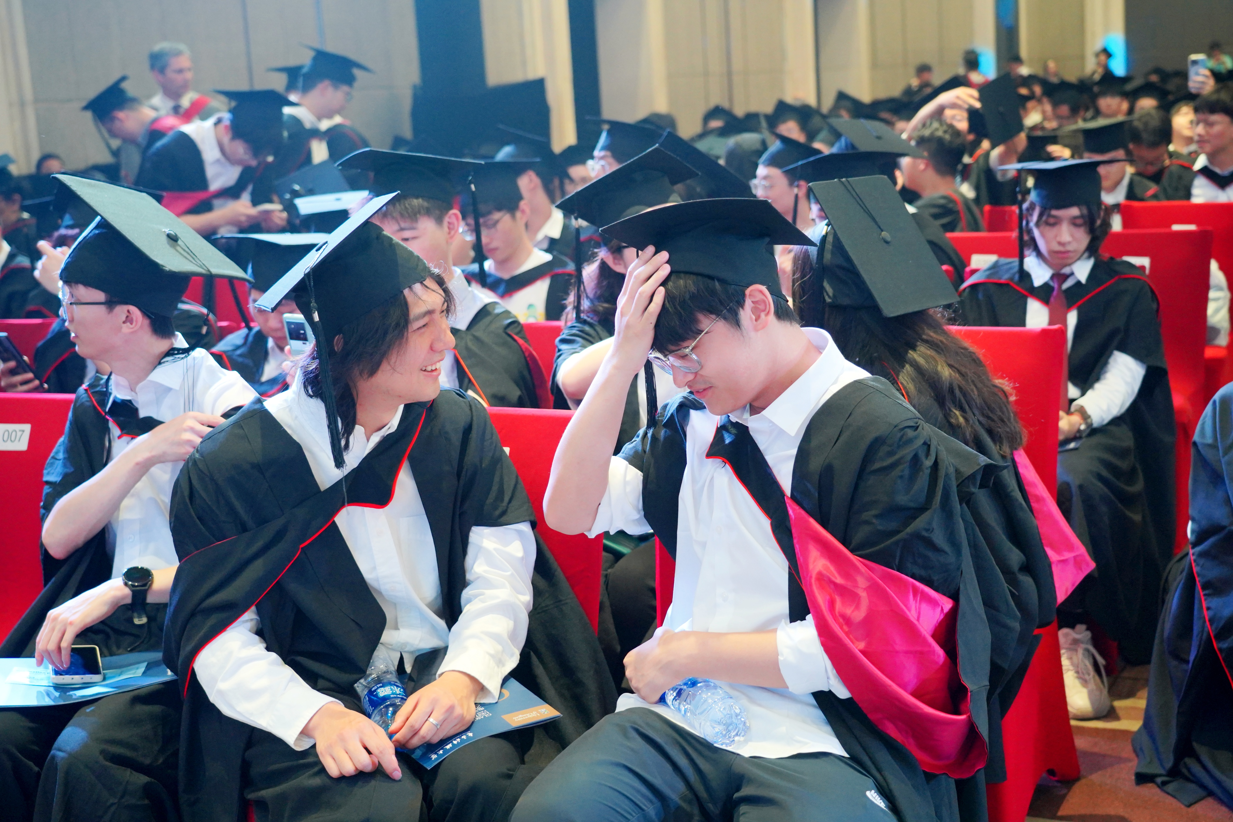 Two students at the graduation ceremony in Chengdu