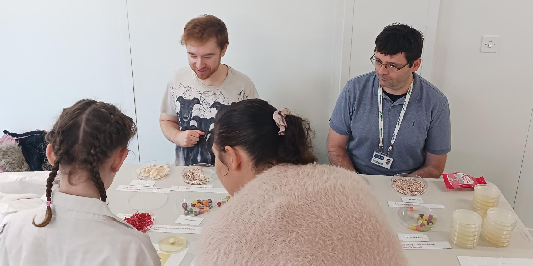 TheSchool of Infection & Immunity volunteers running a stall attending by pupils at a special STEM Day in support of local charity Bridging The Gap