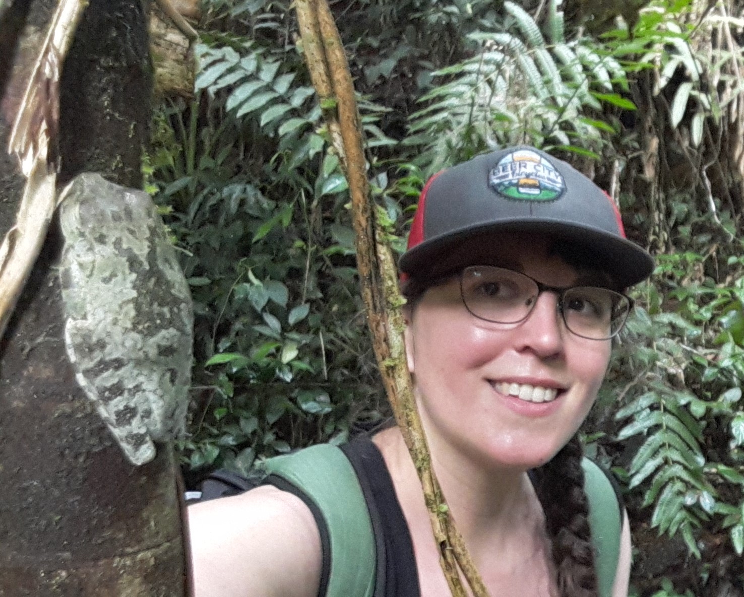 Image of Molly in a forest, with a large frog in the foreground.