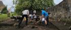 An image of people taking part in an archaeological dig at Govan Old Church