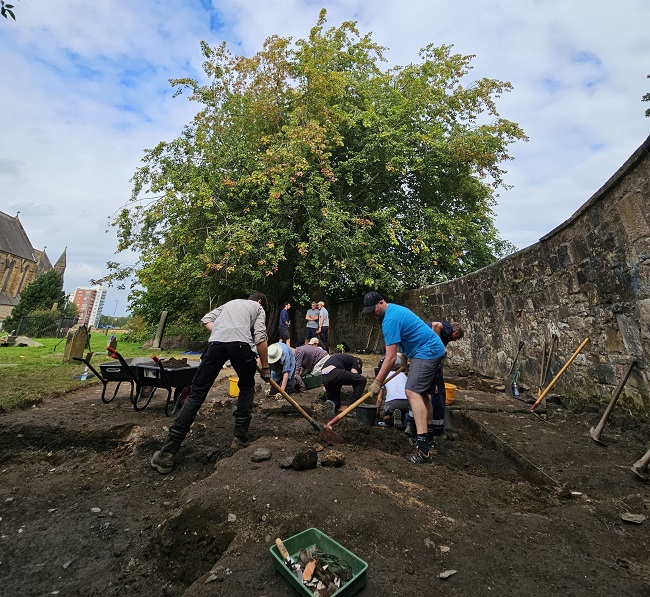 An image of people taking part in an archaeological dig at Govan Old Church