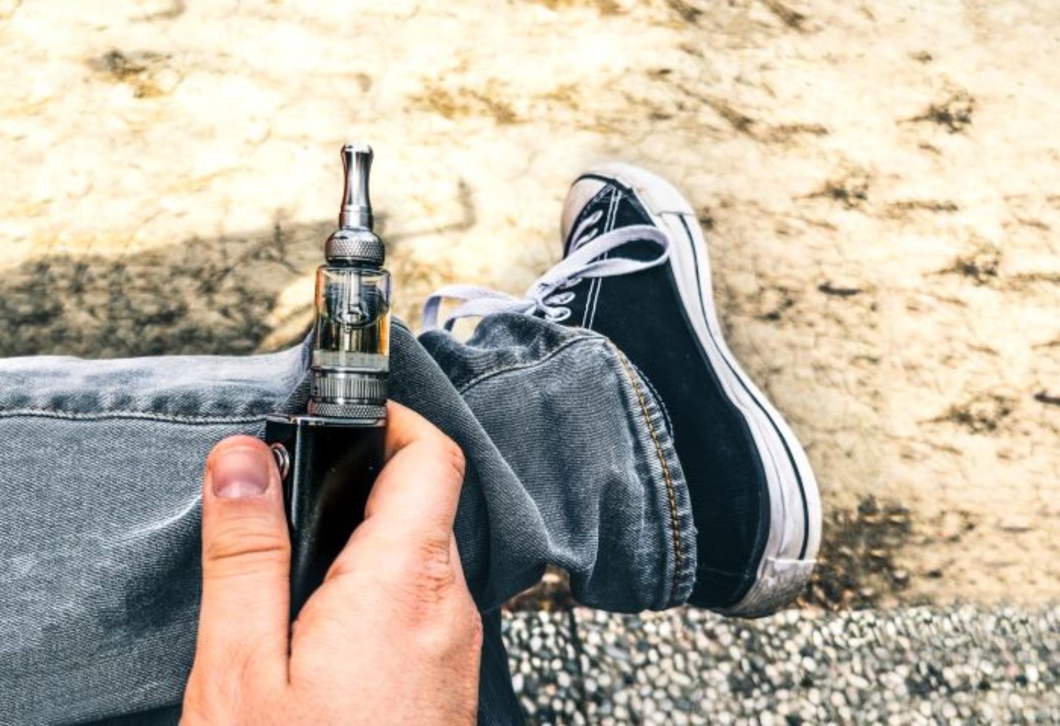 Teenager with e-cigarette