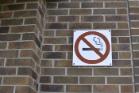 No smoking sign on a brick wall