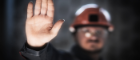 A miner holds his hand up