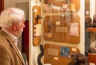 Image of a man looking at some of the exhibits in a glass case in the Hunterian Museumthe Hun