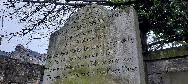 The gravestone of Robert Fergusson. The Scottish Poet is buried in the Canongate Kirk cemetery, Edinburgh, Scotland.