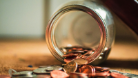 coins falling from a jar