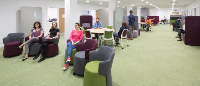 Students sitting in a room designed for study and group work