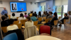 PGR Convener Dr Richard Burchmore presenting to a cohort of PGRs, sat in the SGDB common room