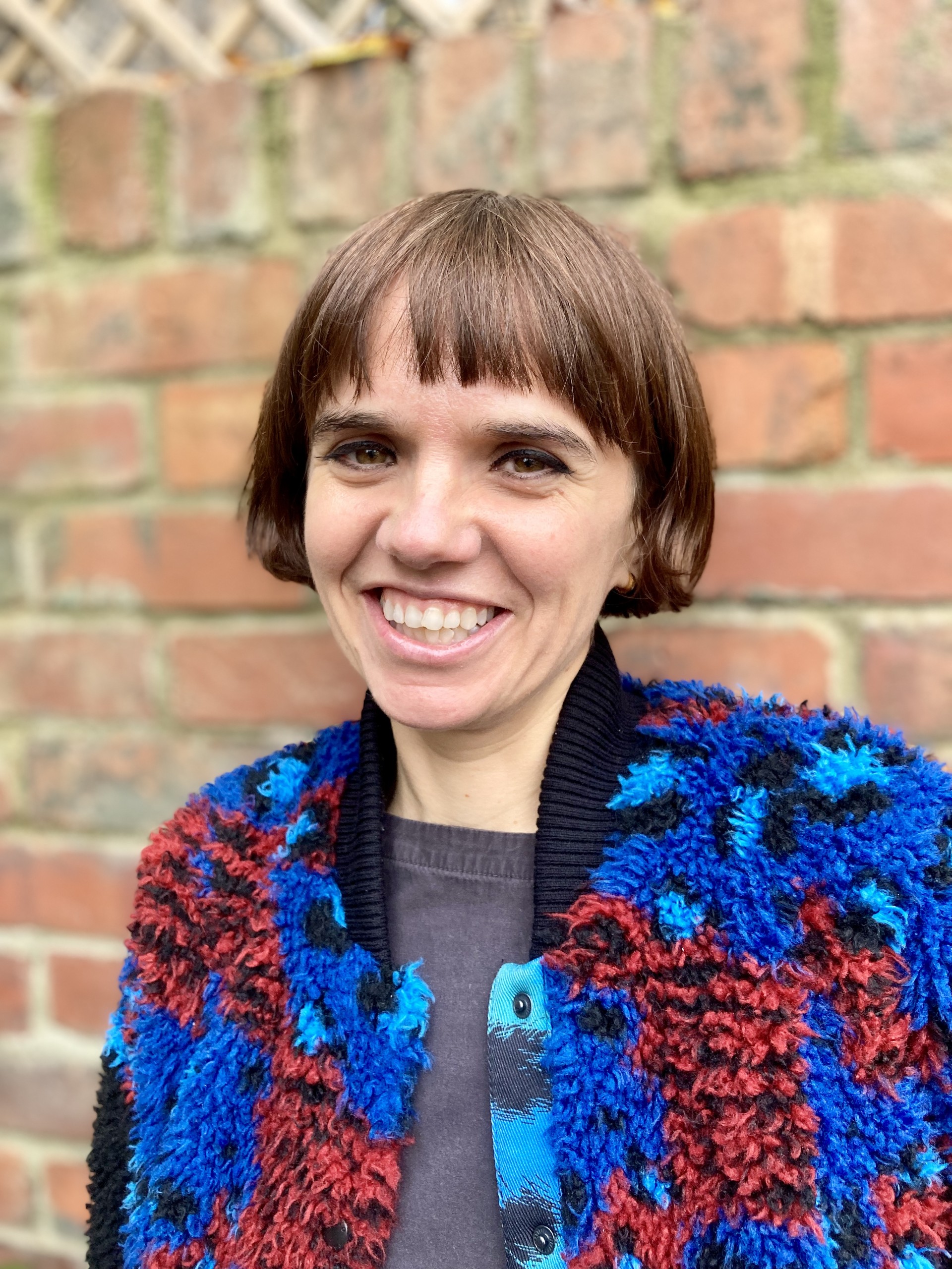 A smiling headshot of Sarah Lester