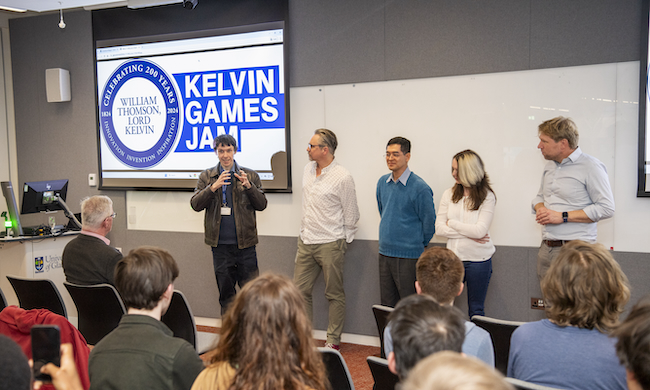 The judging panel present their results at the finals of the Kelvin Game Jam