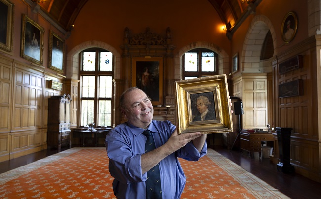 Professor Gerard Carruthers at Barnbougle Castle with the portrait of Robert Fergusson. The newly discovered 18th century portrait of Fergusson is part of the collection of former 19th Century Prime Minister, Archibald Primrose, 5th Earl of Rosebery, 1st Earl of Midlothian, who was a keen collector, historian and writer. Credit Martin Shields