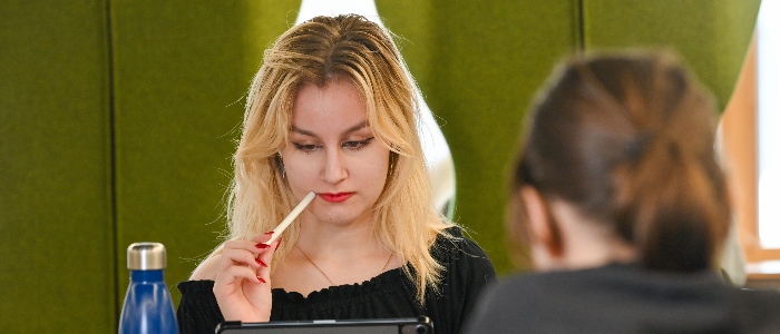 Student studying on a tablet in the University of Glasgow Library