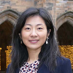 Dr Xiang Li standing in the quadrangle the University of Glasgow