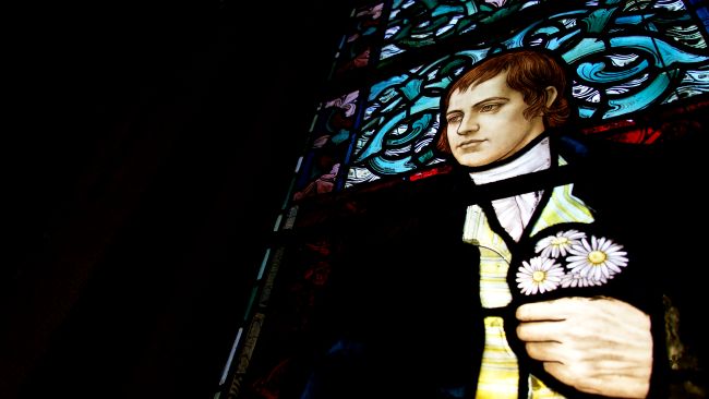 In this window panel Robert Burns is holding a posy of daisies, reflecting one of his best known poems, ‘To a Mountain Daisy’. Credit Darren Jewell-Irons