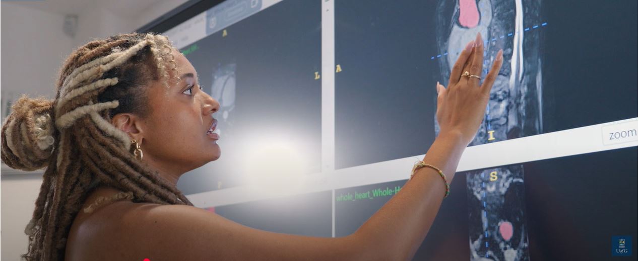 Claire, a PhD student in the school of engineering looking at data on a computer screen