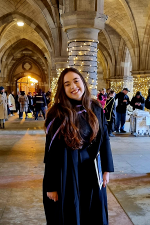 student in cloisters during graduation