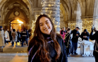 student in cloisters during graduation