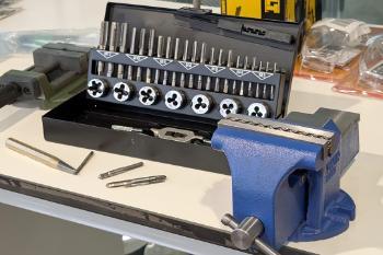 Various tools and a vice on a workbench