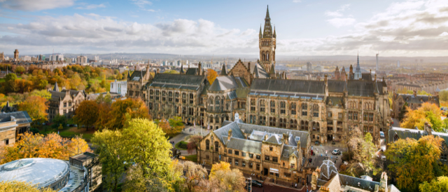 Wide shot of the Glibert Scott Building and tower looking south from the University library