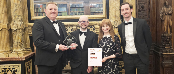 ACPME winners standing with their award