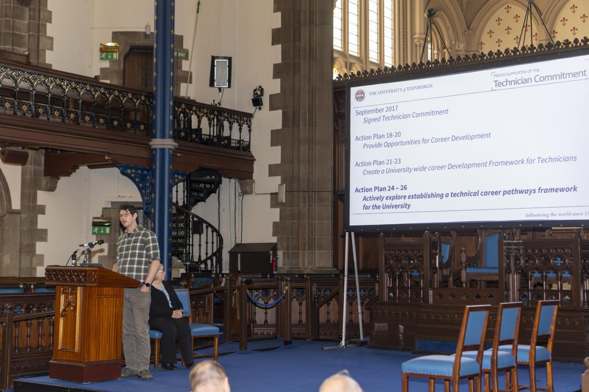person speaking on stage