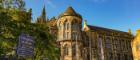 Gilbert Scott Building with a blue University of Glasgow sign