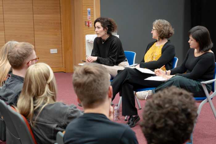 woman talking at panel discussion