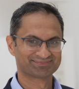 A head and shoulders portrait shot of Neil Basu