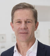 A head and shoulders portrait shot of Stefan Siebert