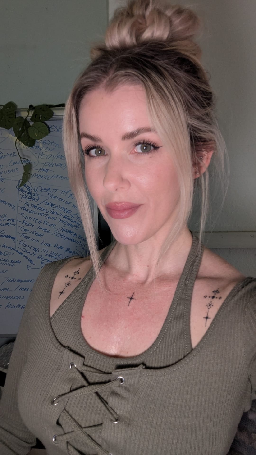 An adult woman smiling into the camera