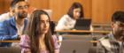 Several students in a lecture theatre