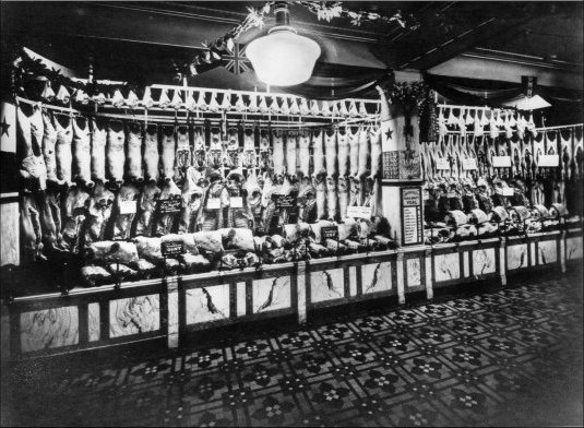 Photograph of the Meat Department in the Food Hall showing a selection of Christmas beef and lamb, particularly from His Majesty’s farms at Balmoral, c1929.  (GUAS Ref: HF 51/8/1/1/3 photo 17. Copyright reserved.)