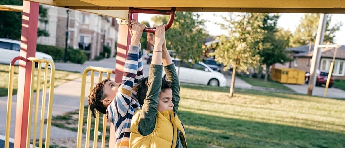 Photo of 2 children on a climbing frame